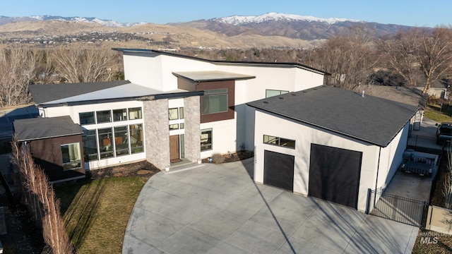 view of front of house with a mountain view and a garage