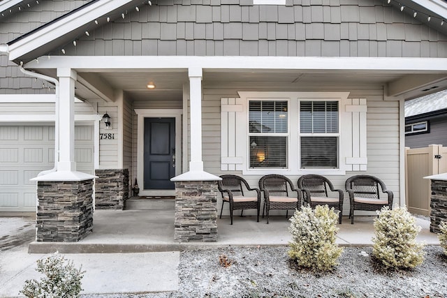 property entrance with covered porch and a garage