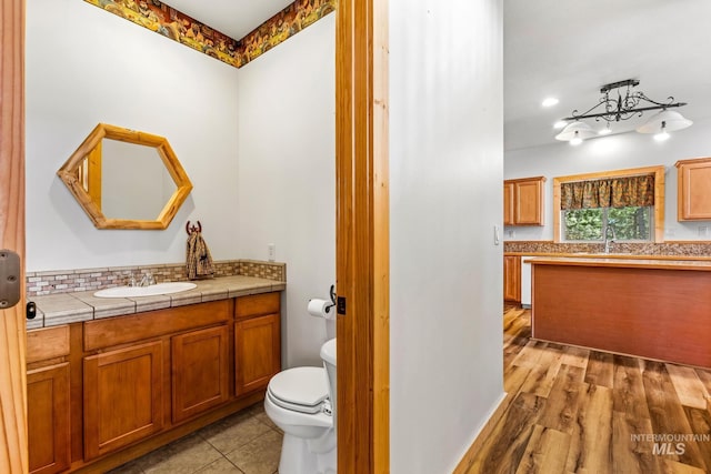 10389 Gamann Dr, Cascade, ID 83611 - bathroom with vanity and decorative backsplash