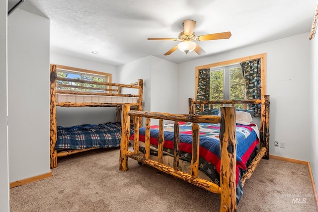 10389 Gamann Dr, Cascade, ID 83611 - carpeted bedroom featuring baseboards and ceiling fan
