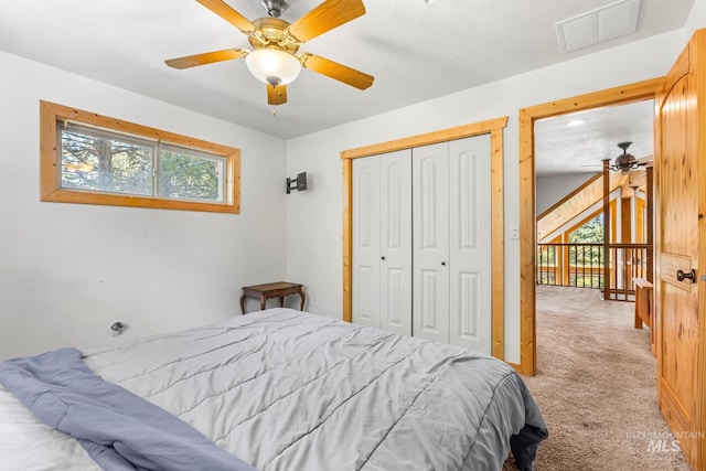 10389 Gamann Dr, Cascade, ID 83611 - bedroom with light colored carpet, a closet, and a ceiling fan