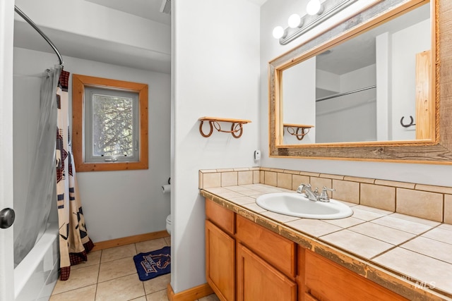 10389 Gamann Dr, Cascade, ID 83611 - bathroom featuring vanity, tile patterned floors, and shower / tub combo with curtain