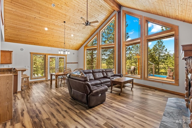 10389 Gamann Dr, Cascade, ID 83611 - living area featuring high vaulted ceiling, a wooden ceiling with exposed beams, ceiling fan, and light wood-type flooring