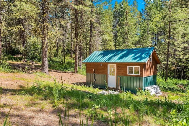 10389 Gamann Dr, Cascade, ID 83611 - view of outdoor structure featuring a view of trees