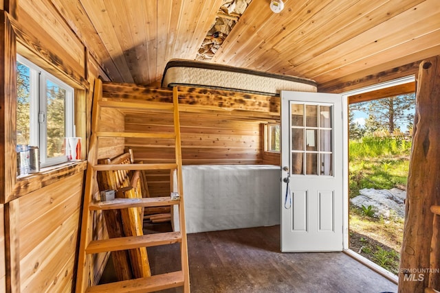 10389 Gamann Dr, Cascade, ID 83611 - unfurnished bedroom featuring wooden ceiling, wooden walls, and wood finished floors
