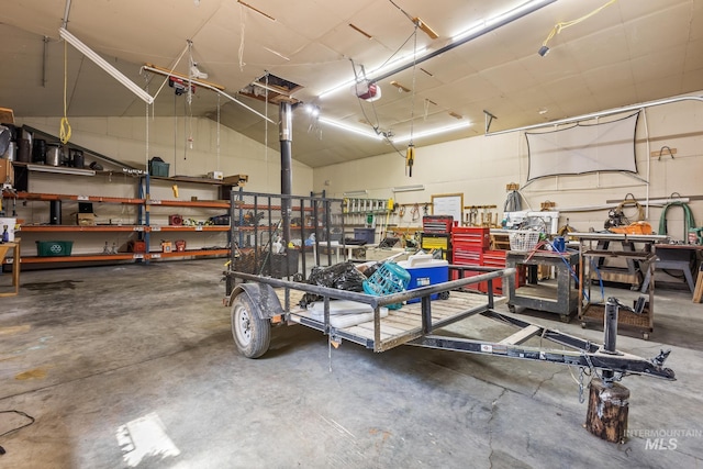 10389 Gamann Dr, Cascade, ID 83611 - garage featuring a workshop area and a garage door opener