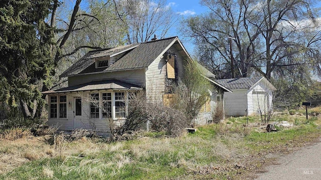 view of home's exterior featuring a shingled roof
