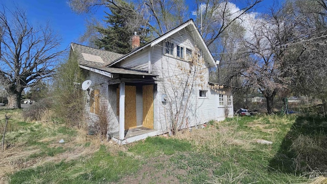 view of home's exterior with a chimney
