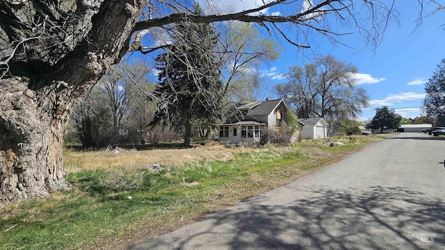 exterior space with a shed and an outbuilding