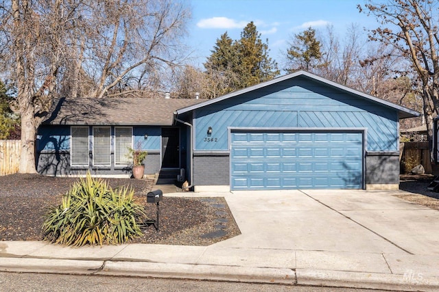 ranch-style house featuring concrete driveway, brick siding, fence, and an attached garage