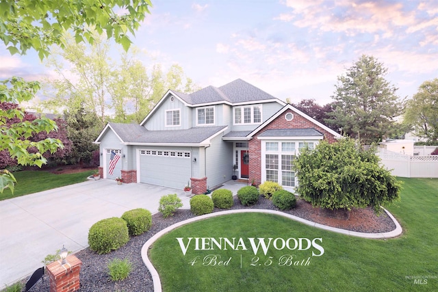 traditional-style home featuring brick siding, driveway, a garage, and board and batten siding