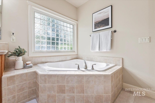 full bath with a bath and tile patterned flooring