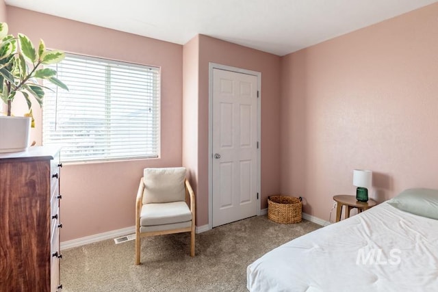 bedroom with carpet flooring, visible vents, and baseboards