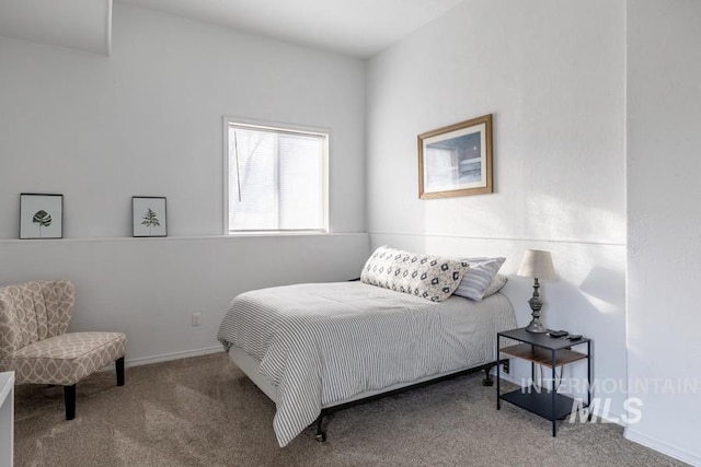 bedroom with baseboards and carpet flooring