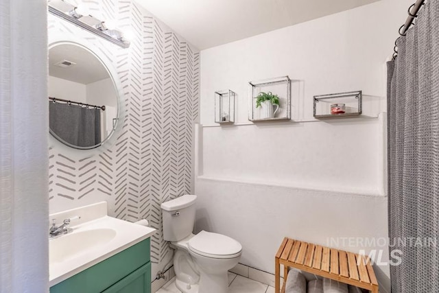 full bathroom featuring vanity and toilet