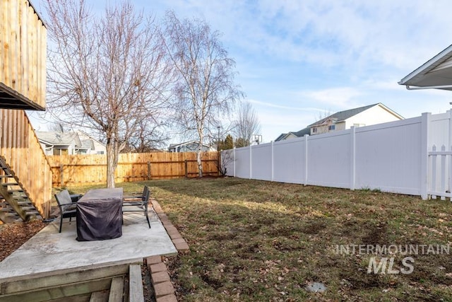 view of yard with a patio and a fenced backyard