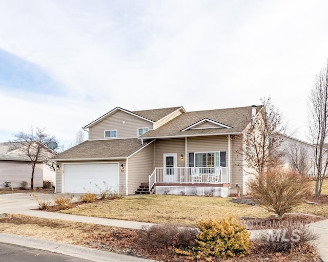 view of front of property with a shingled roof, a front lawn, a porch, a garage, and driveway