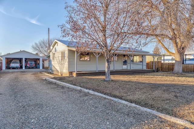 single story home featuring a carport and a garage