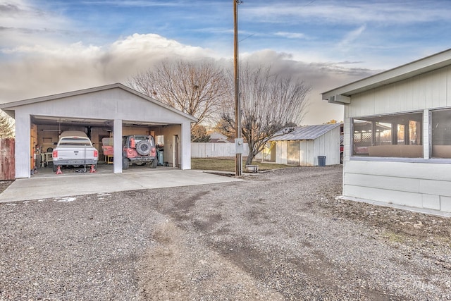 exterior space featuring a garage and an outdoor structure