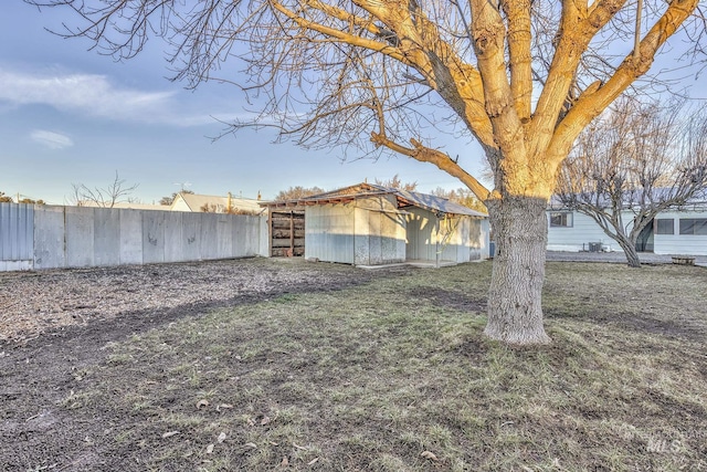 exterior space with a yard and an outbuilding