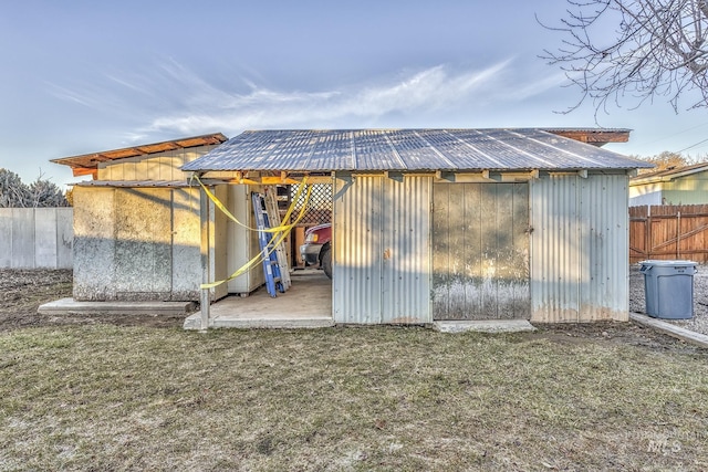 view of outbuilding with a lawn