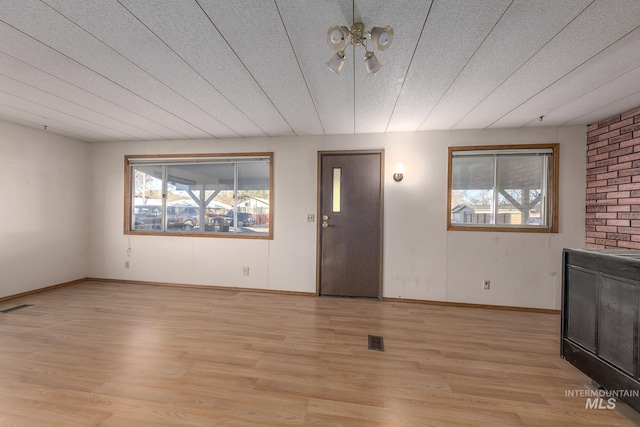 unfurnished living room with light hardwood / wood-style flooring