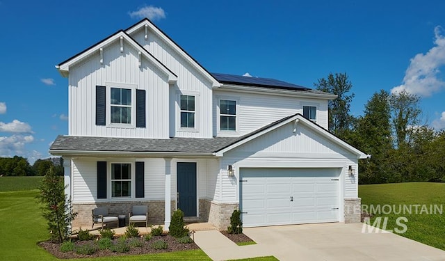 608 E Lockhart St, Meridian, ID 83646 - view of front of property featuring a front yard, solar panels, covered porch, driveway, and board and batten siding