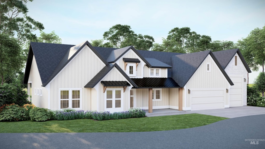 modern inspired farmhouse featuring driveway, a standing seam roof, a porch, a front yard, and metal roof