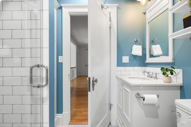 1312 E Warm Springs Ave, Boise, ID 83712 - bathroom featuring vanity, a shower, toilet, and wood finished floors