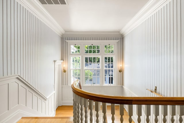 1312 E Warm Springs Ave, Boise, ID 83712 - staircase with wallpapered walls, wood finished floors, crown molding, and a wainscoted wall