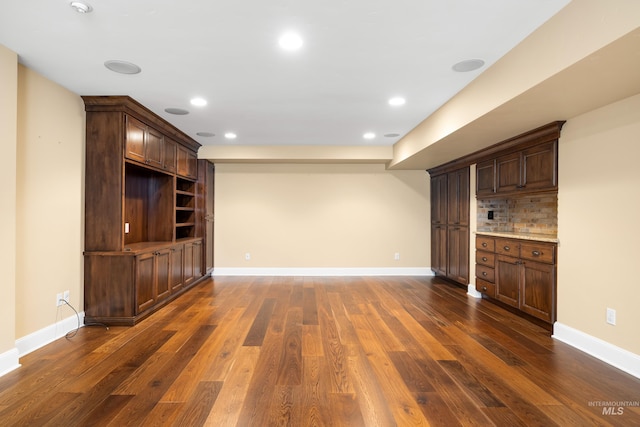 1312 E Warm Springs Ave, Boise, ID 83712 - unfurnished living room with dark wood finished floors, recessed lighting, and baseboards