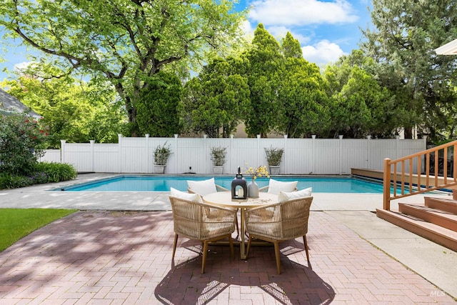 1312 E Warm Springs Ave, Boise, ID 83712 - view of swimming pool featuring a patio area and view of wooded area
