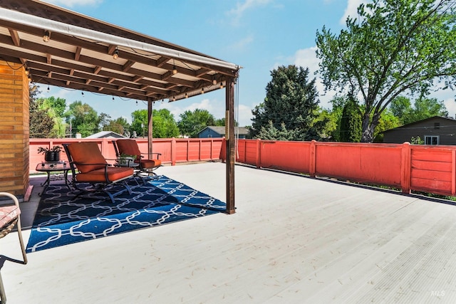 view of patio featuring fence