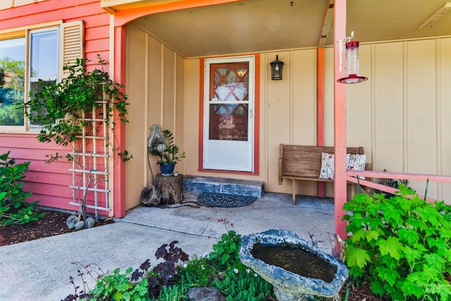 doorway to property with board and batten siding