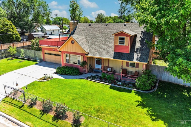 view of front of house with board and batten siding, a shingled roof, an attached garage, concrete driveway, and a chimney