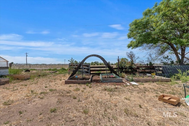 764 NW Beaman St, Mountain Home, ID 83647 - view of play area with a vegetable garden
