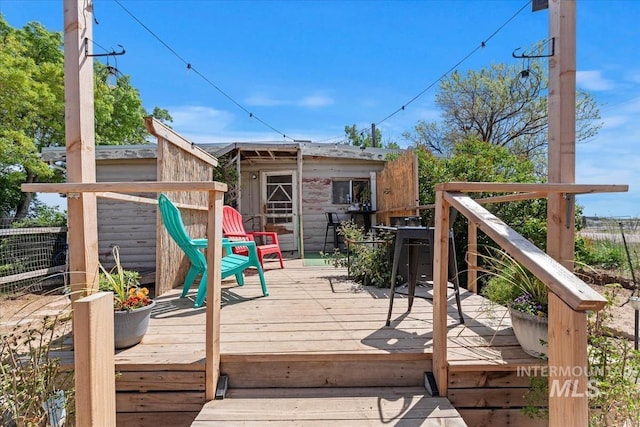 764 NW Beaman St, Mountain Home, ID 83647 - wooden deck with an outbuilding