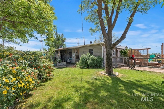 764 NW Beaman St, Mountain Home, ID 83647 - back of house with a playground and a sunroom