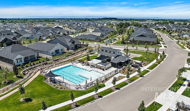 birds eye view of property with a residential view