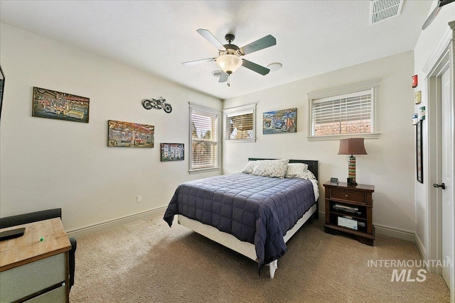 bedroom featuring carpet flooring, baseboards, a ceiling fan, and visible vents