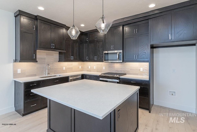 1333 N Webb Way, Meridian, ID 83642 - kitchen featuring appliances with stainless steel finishes, light wood-type flooring, light countertops, and recessed lighting