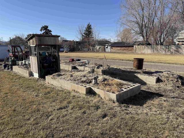 145 N Lincoln, Oakley, ID 83346 - view of yard featuring an outbuilding, a vegetable garden, and fence