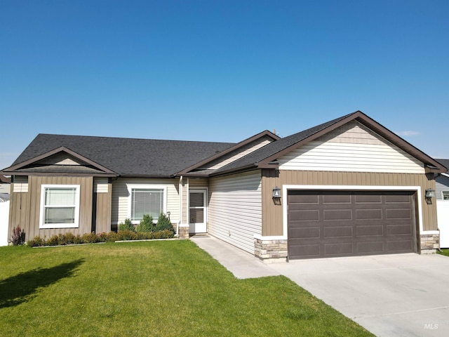 single story home featuring a front yard and a garage