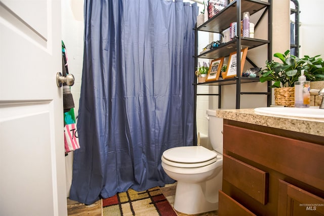 full bathroom with vanity, toilet, shower / tub combo with curtain, and hardwood / wood-style floors