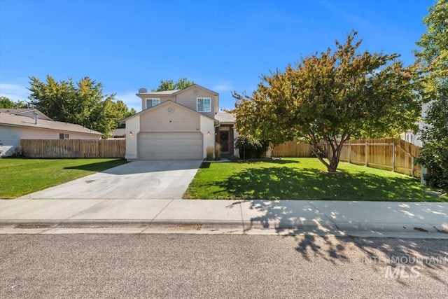 view of front of home featuring a garage, fence, concrete driveway, and a front yard