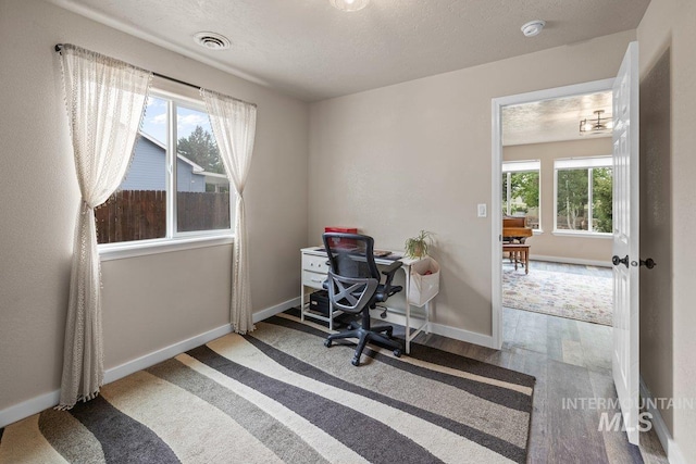 12339 W Foxhaven St, Star, ID 83669 - office space featuring wood finished floors and a textured ceiling