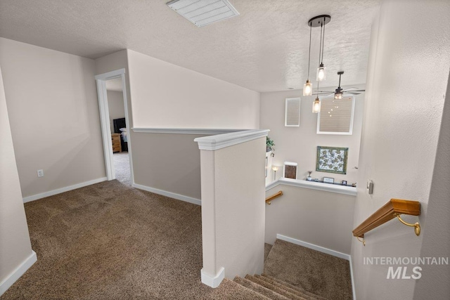 12339 W Foxhaven St, Star, ID 83669 - staircase featuring a textured ceiling, carpet flooring, and a ceiling fan