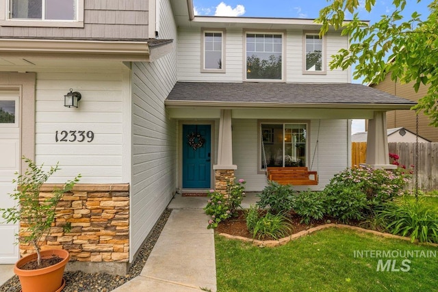 12339 W Foxhaven St, Star, ID 83669 - property entrance featuring roof with shingles and covered porch