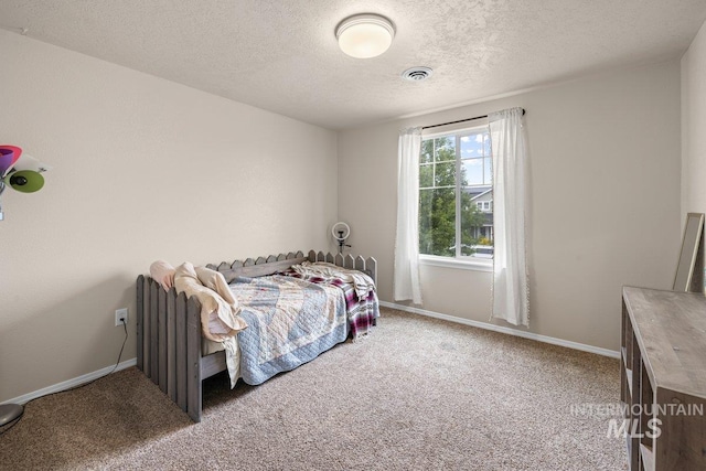 12339 W Foxhaven St, Star, ID 83669 - carpeted bedroom featuring a textured ceiling and baseboards