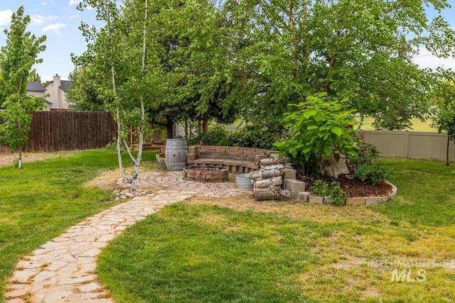 12339 W Foxhaven St, Star, ID 83669 - fenced backyard with an outdoor fire pit